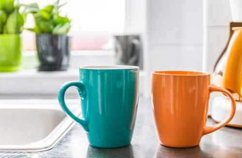 two coffee mugs on a counter